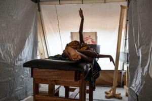 Sonia, 21, prepares to have her baby on the delivery table at the MSF hospital at M’Poko camp, Bangui, Central African Republic