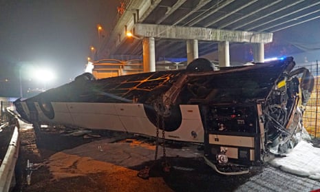 The wreckage of a passenger bus fell from an overpass ending up on railway tracks in Mestre, near Venice, Italy, late 3 October 2023.