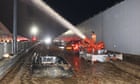 South Korea floods: 13 bodies pulled from road tunnel as search continues
