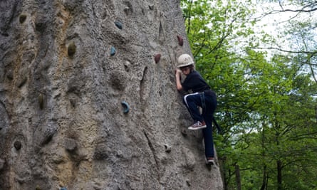 12 year-old boy’s climbing tower in woods at YHA Edale.