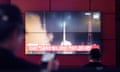 A TV screen shows a file image of North Korea's spy satellite launch. The rocket launch ended in an explosion mid-air, Pyongyang said on Monday.