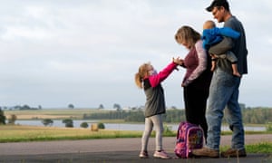 Students return to school on Prince Edward IslandAnnie Drake waits with her parents Amanda and Austin Drake for her school bus as schools reopen with measures in place to prevent the spread of coronavirus in Vernon Bridge, Prince Edward Island, Canada 8 September 2020.
