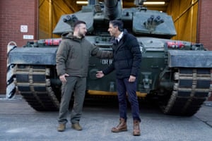 Prime Minister Rishi Sunak and Ukrainian President Volodymyr Zelensky meet Ukrainian troops being trained to command Challenger 2 tanks at a military facility in Lulworth, Dorset