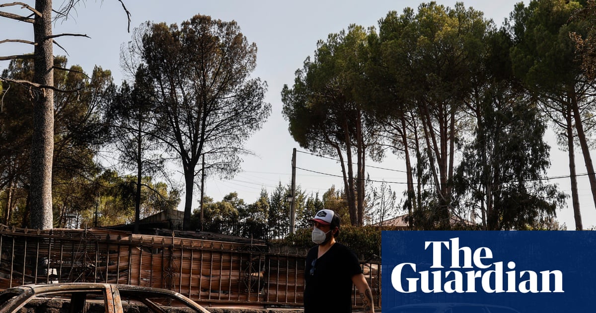 ‘The breath just went out of us’: people return to their homes after wildfires near Madrid