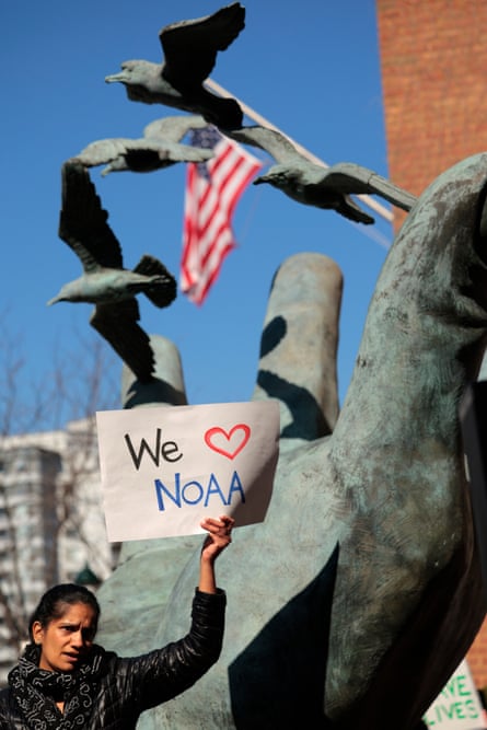 One of hundreds of demonstrators who protested against Trump administration cuts outside the National Oceanic and Atmospheric Administration in Maryland in March.