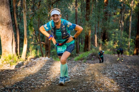 Trail runner in colourful clothes and a running vest