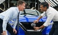Rishi Sunak and Jeremy Hunt attach a Nissan badge to a car during a visit to the car plant in Sunderland.