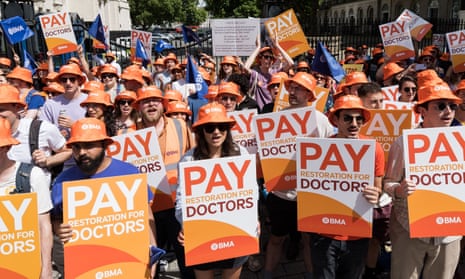 Junior doctors take part in a rally outside Downing Street as members of the British Medical Association walk out for five days in a strike action over pay in the run up to the general election.
