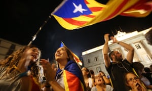 People waving Catalan independence flags in Barcelona last year.