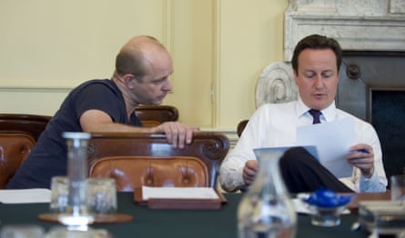 two men look over papers