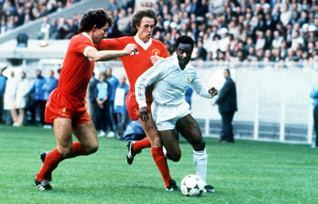 Graeme Souness and Phil Neal track Laurie Cunningham.