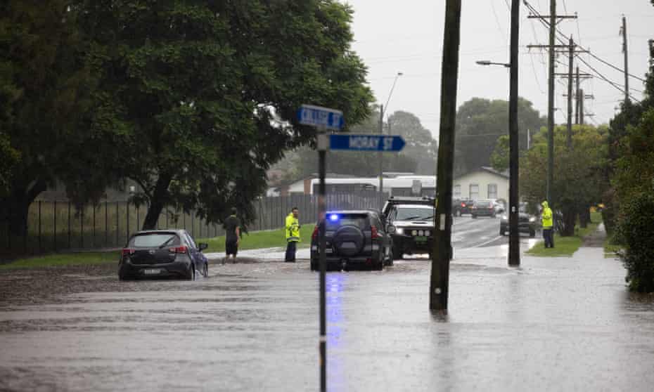 After a car tuck in flood water on College Street, Richmond as police tell residents in low-lying areas to evacuate homes with more flooding expected. 