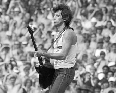 Keith Richards playing guitar connected stage