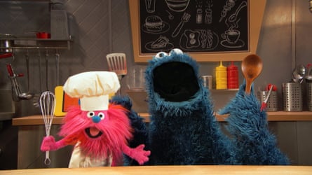Gonger is a cheerful red monster in chef’s whites, while Cookie Monster wields a wooden spoon