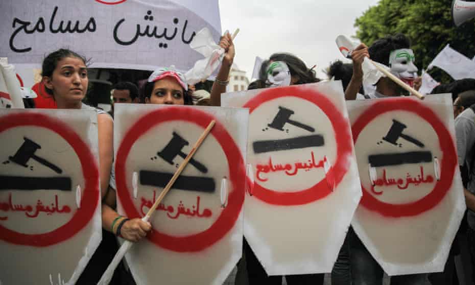 Female demonstrators take to the streets of Tunis to protest against the government’s controversial reconciliation act
