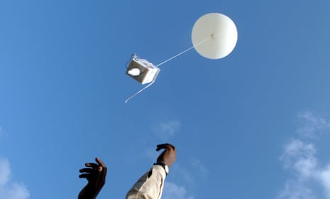 Meteorologists release a hydrogen-filled weather balloon in Mumbai, India.