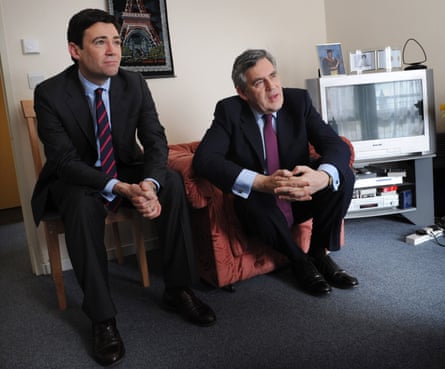 British Prime Minister Gordon Brown (R) and Health Secretary Andy Burnham (L) meet Sylvia Thomas, 81, (not pictured) in her social housing flat at Lingham Court in Stockwell, south London, on 30 March 2010