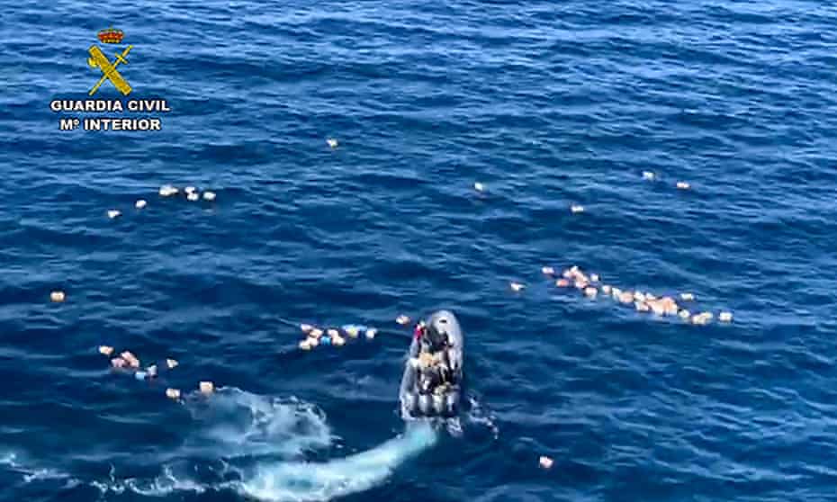 This Spanish police picture shows a speedboat surrounded by bundles of drugs packages, after a police high-speed chase with smugglers off Malaga. 