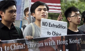 Taiwanese protesters hold slogans reading “No extradition to China” during a rally to oppose Hong Kong’s contentious extradition bill