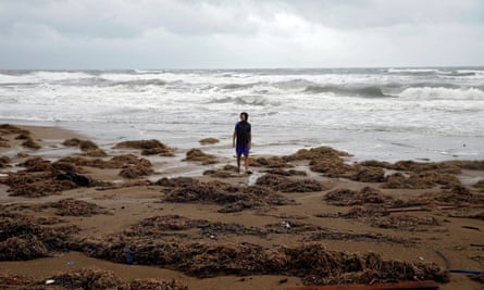 A man stands beside the sea near the town of Amaliada, western Greece