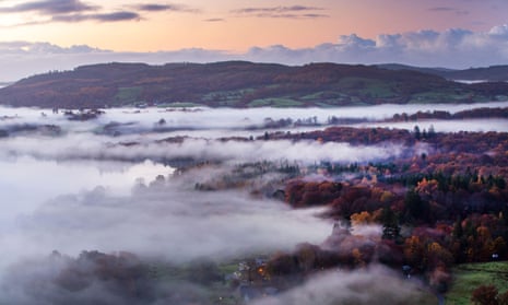 Mist over Lake Windermere from Todd Crag at sunrise, Lake District.