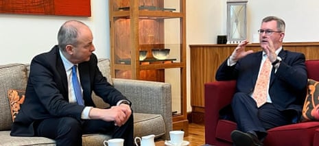 Micheál Martin (left) meeting with Sir Jeffrey Donaldson at the Grand Central Hotel in Belfast this morning.