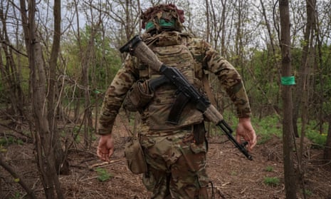 A Ukrainian serviceman walks at a frontline in the Donetsk region of Ukraine.