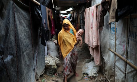 A Rohingya refugee walks through Kutupalong camp in Cox’s Bazar, Bangladesh