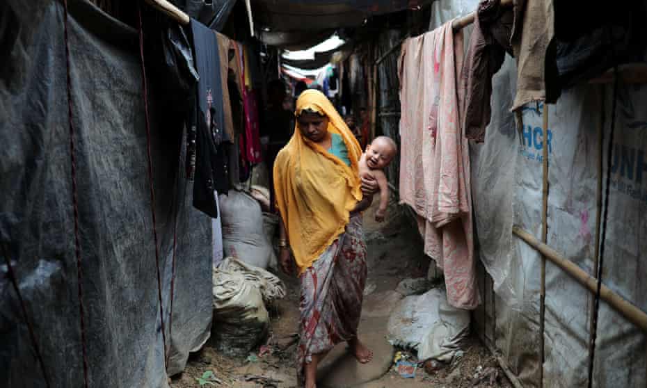 A Rohingya refugee woman walks through the Kutupalong camp in Cox’s Bazar in Bangladesh.