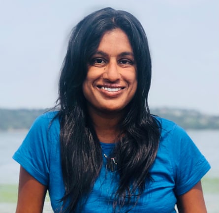 Journalist Vauhini Vara in blue t-shirt smiles at the camera