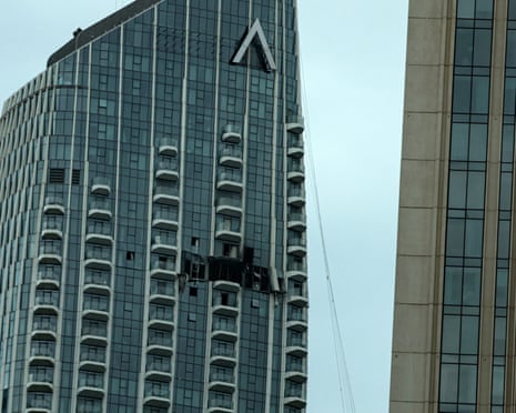 A damaged part of the Dubai Creek Harbour Tower after it was hit by an Iranian drone attack in Dubai on Thursday