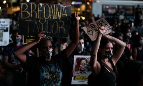 People participate in a march in New York City after the announcement of a single indictment in the Breonna Taylor case.