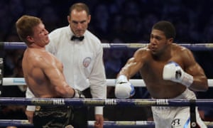 Alexander Povetkin reels after taking a right hook from Anthony Joshua, shortly before the WBA, IBF, WBO and IBO heavyweight champion finished the fight