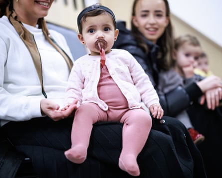 Babies on women’s laps