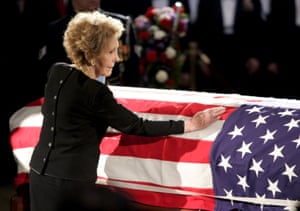 Nancy Reagan touches the casket of her husband