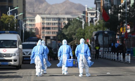Medical workers arrive at a residential community where people are under Covid lockdown in Hohhot, Inner Mongolia