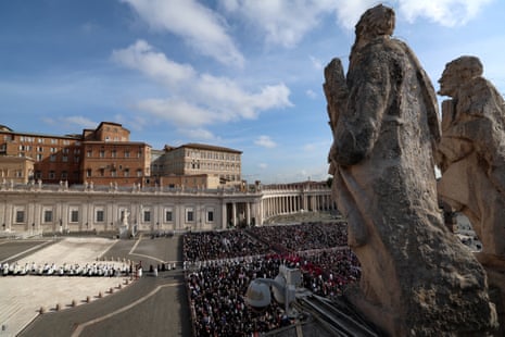 The faithful gather in St. Peter's Square as members of the clergy walk to St. Peter's Basilica on the day of the translation of Pope Francis' body and its transfer to the basilica.