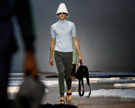 A model wears items from Prada’s spring-summer 2026 menswear collection, including leather sandals, at Milan fashion week on 22 June.