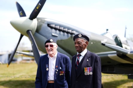 Jacob and Gumbley in uniforms and medals with plane in background
