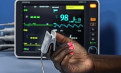 Hand with oxygen monitor on finger