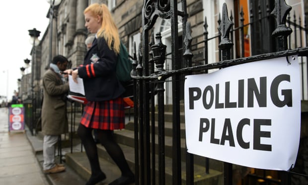 A young voter leaves a polling station in Scotland