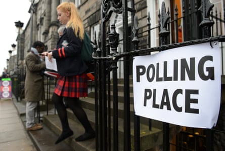 A young voter leaves a polling station after casting her vote in Edinburgh, Scotland, ina referendum for Scotland's independence