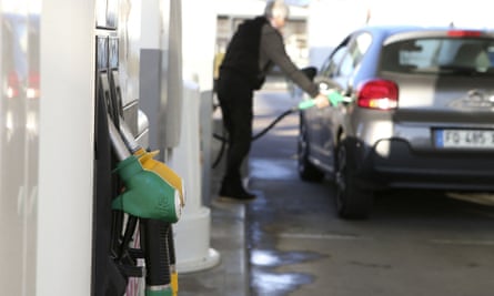 A man fills his petrol tank at a forecourt in Ajaccio on the French Mediterranean island of Corsica.