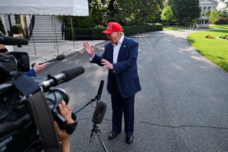 Donald Trump speaks to press before boarding Marine One to depart for Florida on Tuesday morning.