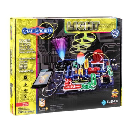 Packaging for a Snap Circuits Light electronics kit showing lights, wires, and a smartphone