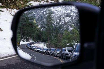 traffic from the view of a car’s side-view mirror