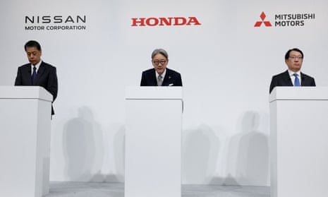 The bosses of Nissan, Honda and Mitsubishi hold a press conference on their merger talks in Tokyo