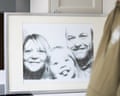 A framed photograph of Darren Rosheski and Helen Dutton with their daughter