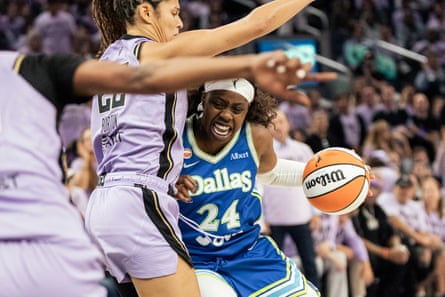 Arike Ogunbowale drives against Veronica Burton during the fourth quarter of the Dallas Wings’ 77-73 loss to the Golden State Valkyries in Game 3 of their first-round WNBA playoff series on Friday in San Francisco.