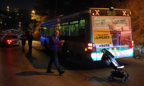 Israeli security forces inspect the bus after the shooting attack